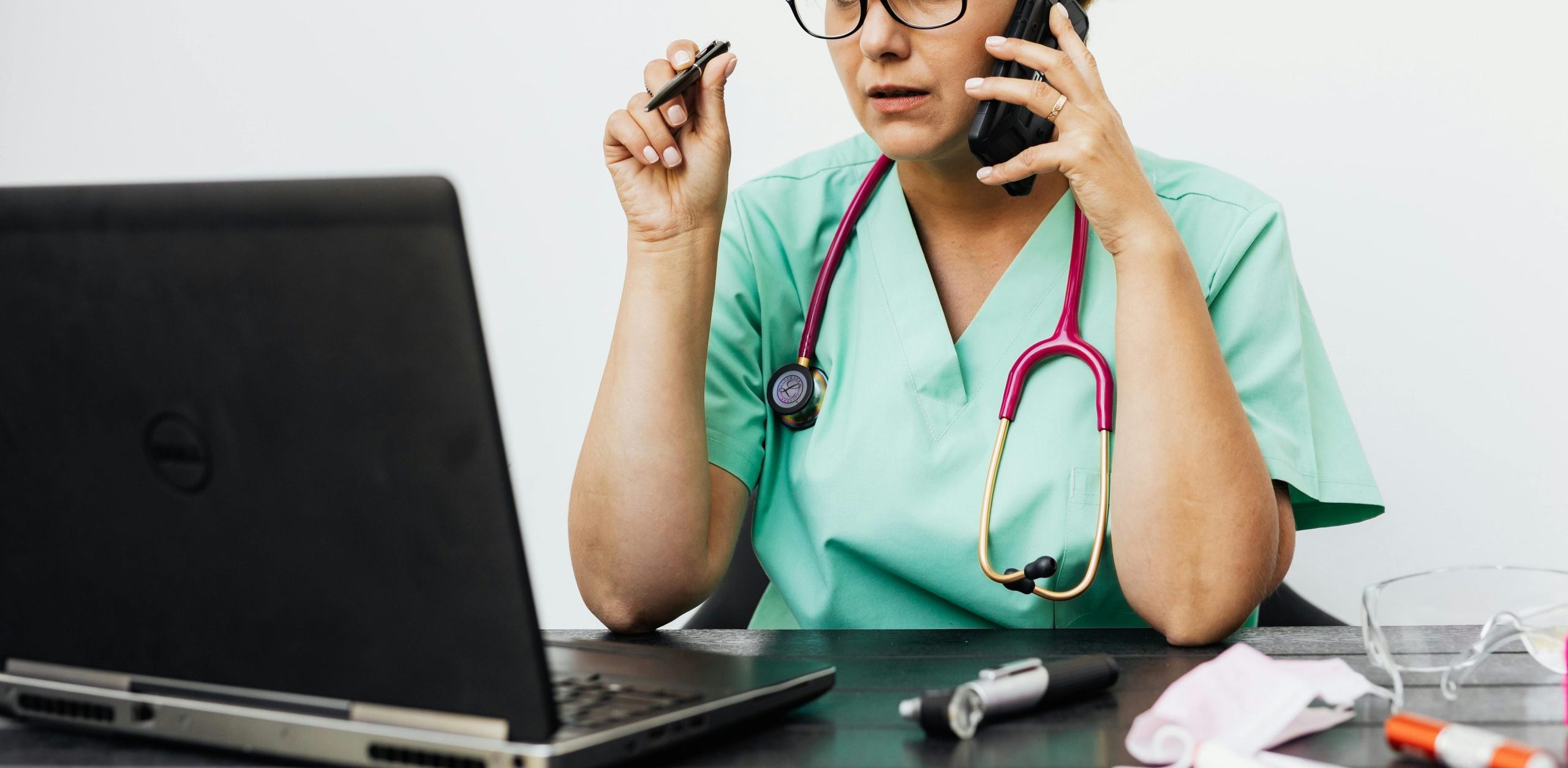 Calling doctor on the phone for telemedicine visit at Global Integrative Medicine to be seen by Naturopathic Doctor Dr Matesa Pringle